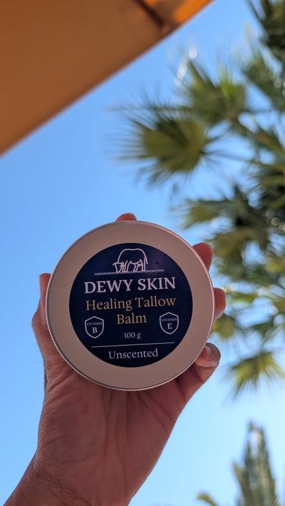 hand showing Dewy Skin Natural healing tallow balm in sun shade