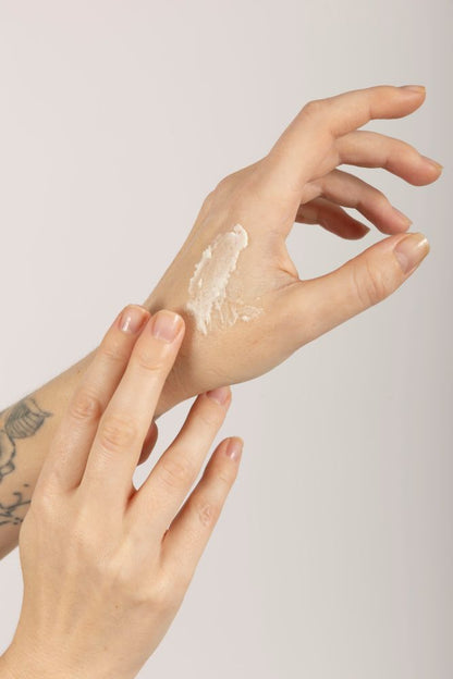 Woman applying Dewy Skin Natural Healing Tallow Unscented Balm on hands