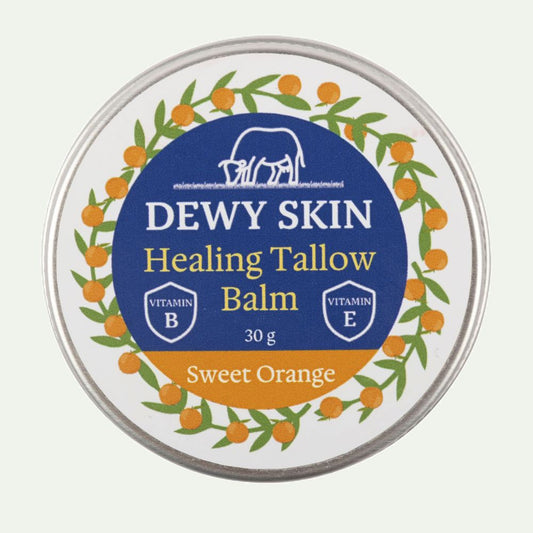 Macro close-up of Dewy Skin Natural Healing Tallow Balm Sweet Orange jar
